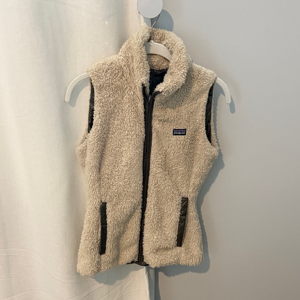Patagonia Women’s Reversible Cream Vest with Brown Accents.